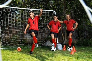 Three sexy girls warm up on the soccer field from Naughty America